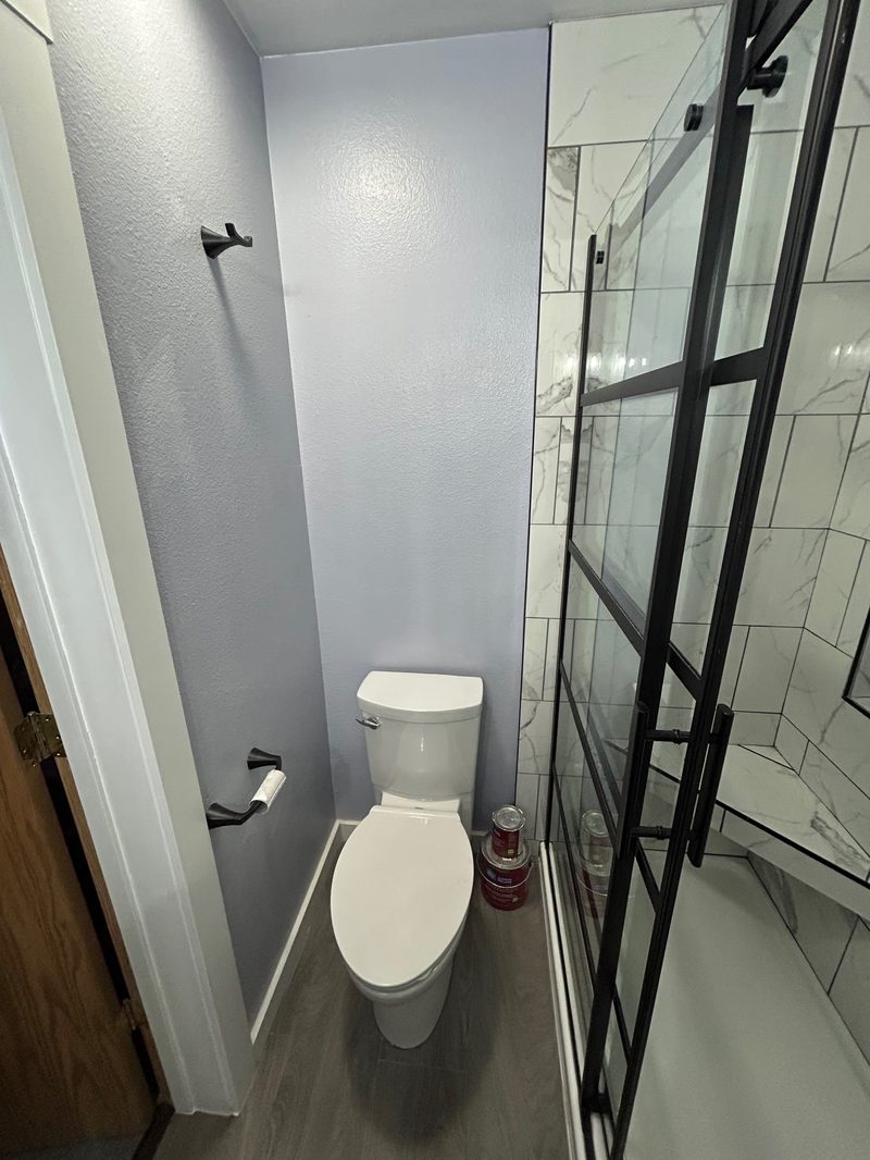 Full bathroom remodel with black fixtures