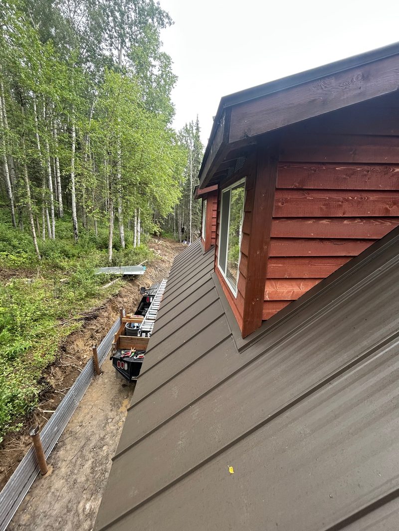 Red cabin siding installation detail